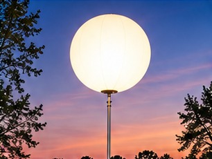 Airstar Crystal inflatable light balloons illuminating a courtyard at night